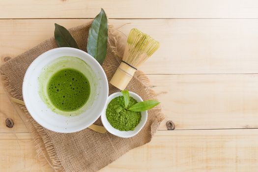 Set of matcha powder bowl, wooden spoon and whisk, green tea leaf, Organic Green Matcha Tea ceremony.