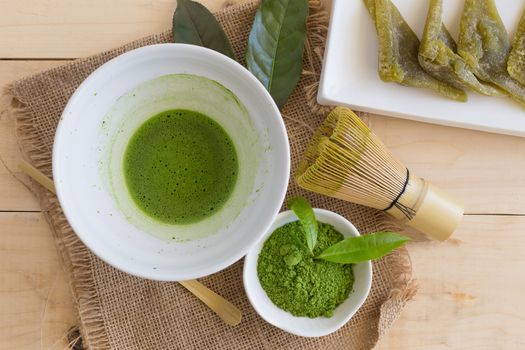 Set of matcha powder bowl, wooden spoon and whisk, green tea leaf, Organic Green Matcha Tea ceremony.