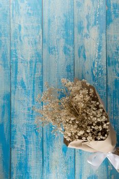 Dry bouquet on a blue Rustic Background.