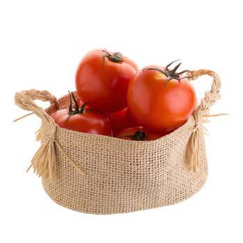 Tomato In the basket isolated on a white background.