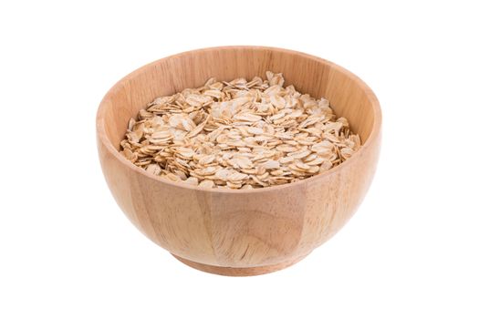 Oat flakes in a wooden bowl on a white background