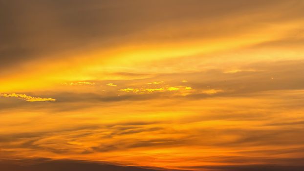 Colorful dramatic sky with cloud at Sunrise.Sky with sun background