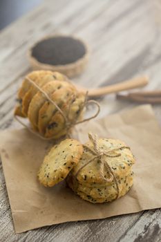 Sesame Cookies, sesame and milk on black wooden background.