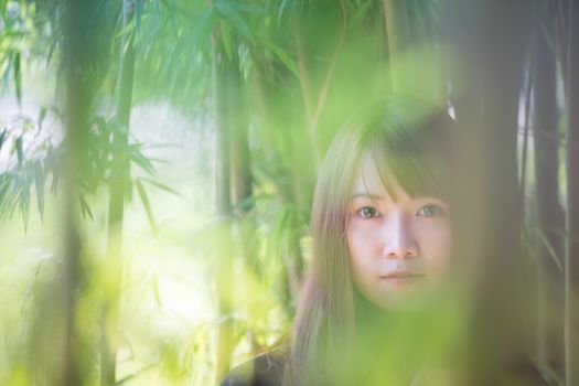 Portrait of asian japanese school girl costume looking at park outdoor film vintage style