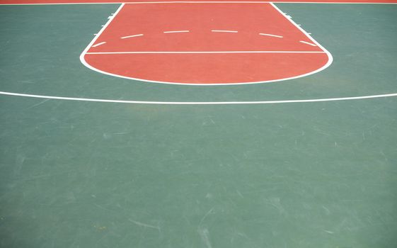 Empty basketball court with drawn lines