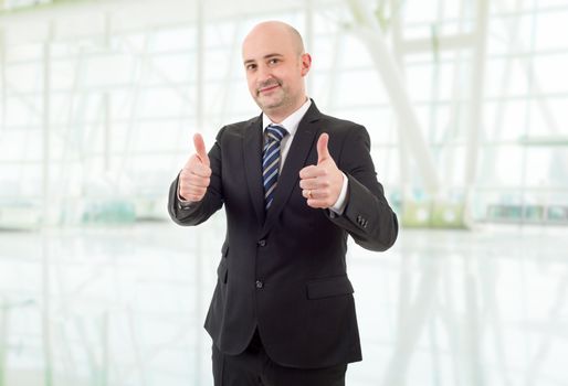 happy business man going thumbs up, at the office