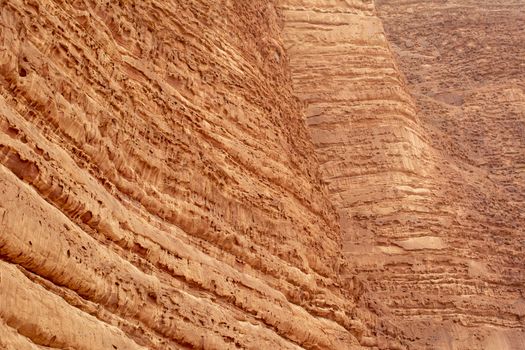 Close-up and detail of the geology and structure of the Khazali mountain in Wadi Rum. Travel and tourism in Jordan.