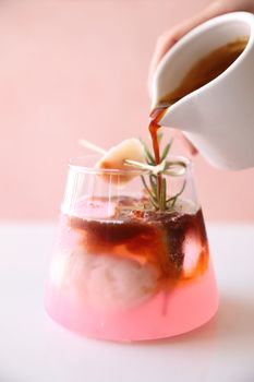lychee juice with coffee in pink background
