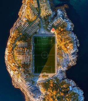 Football field in Henningsvaer from above. Henningsvaer is a fishing village located on several small islands in the Lofoten archipelago in Norway.