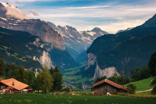 Lauterbrunnen valley located in the Swiss Alps near Interlaken in the Bernese Oberland of Switzerland, also known as the Valley of waterfalls. Cold evening. Viewed from the alpine village of Wengen.