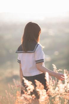 Portrait of asian japanese school girl costume looking at park outdoor film vintage style