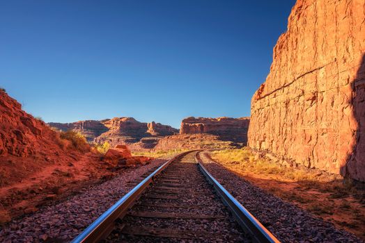 Railroad tracks going through a remote desert canyon near Corona Arch Trail in Utah