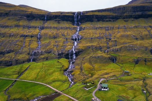 Aerial view of waterfalls in the village of Saksun on the Faroe islands, Denmark.