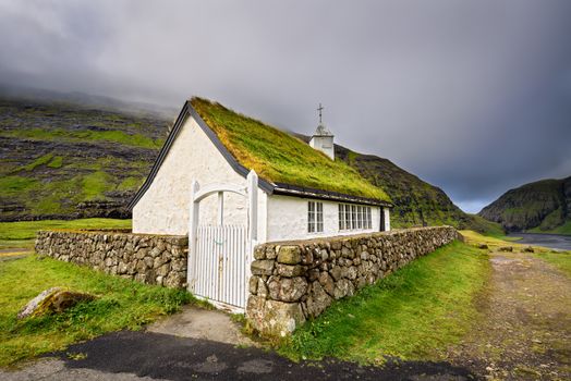 Small village church in Saksun located on the island of Streymoy, Faroe Islands, Denmark