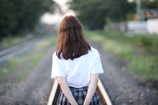 Portrait of asian japanese school girl costume looking at park outdoor film vintage style