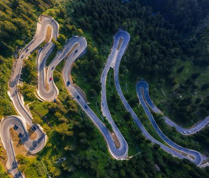 Aerial view of Maloja Pass road in Switzerland. This Swiss Alps mountain road is located in dense forests of the canton Graubunden.
