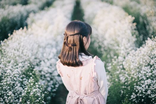 Portrait asian girl with little white flowers background