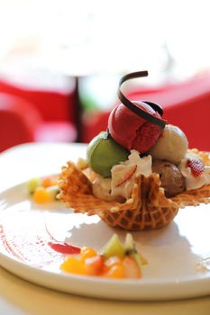 ice cream on waffle and fruit topping