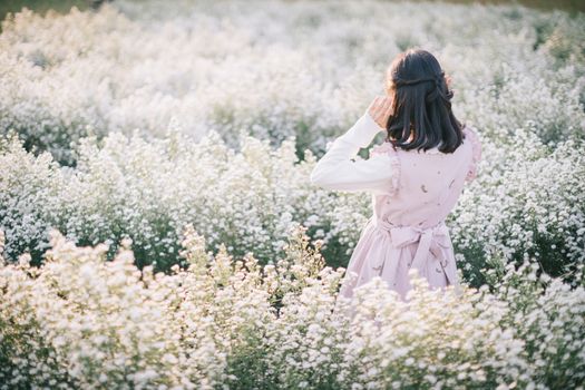 Portrait asian girl with little white flowers background