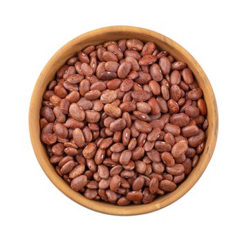 pinto beans in a wooden bowl isolated on a white background.