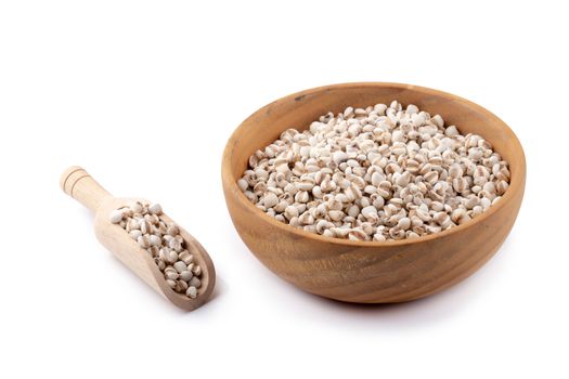 Millet rice in a wooden bowl isolated on white background.