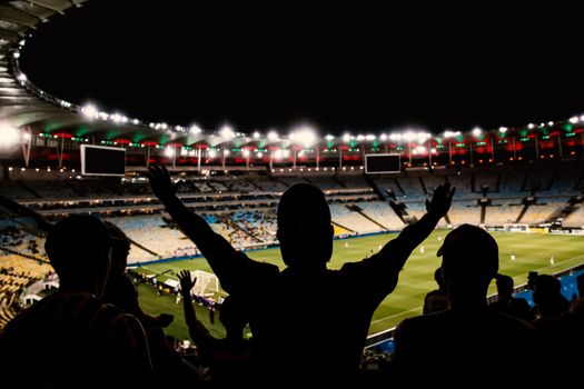 Football, soccer fan support their team and celebrate goal, score, victory. Black silhouette