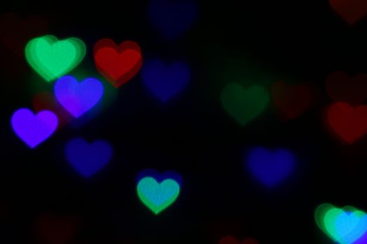 Valentines Colorful heart-shaped bokeh on black background lighting bokeh for decoration at night backdrop wallpaper blur valentine, Love Pictures background, Lighting heart shaped soft night abstract