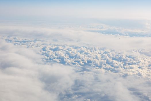 Blue sky from airplane. View above the clouds