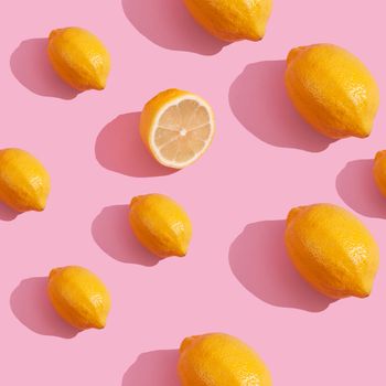 Trendy isometric Seamless continuous pattern of yellow lemons on pink background. Minimalist concept of fresh citrus fruit