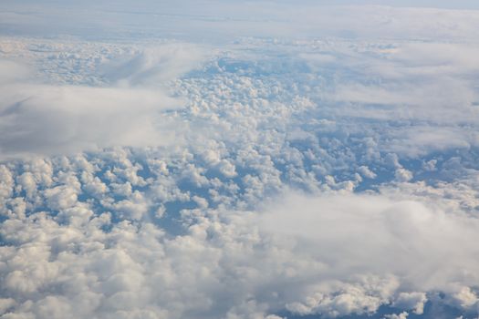 Blue sky from airplane. View above the clouds