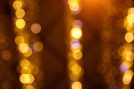 Golden abstract bokeh background. Round lights