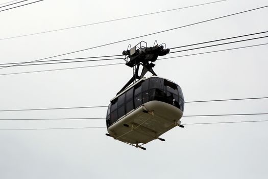 Cabin cableway on a background of cloudy sky