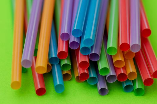 Macro shot of straws against green background