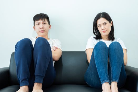 An Asian couple stays together with boring and social distancing.