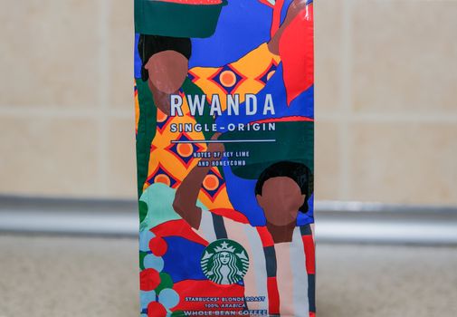 Seasonal beverage Rwanda coffee bag with green & white siren company logo.