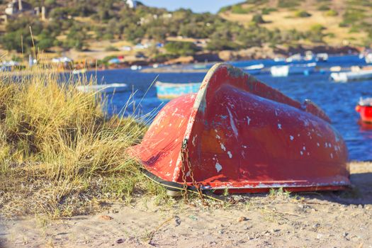 Old red boat on marinas coast