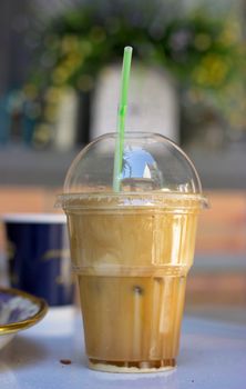 Iced coffee frappe in plastic cup 