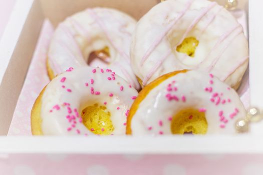 White icing doughnuts in decorated  gift box