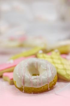 First birthday cookies - cookies and white decorated doughnut, with copy space