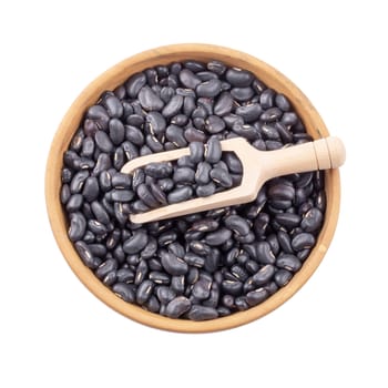 Black bean in a wooden bowl isolated on white background.