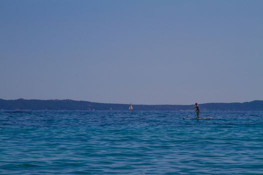 A person paddle boarding in the sea