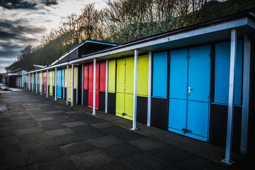 Colorful seaside beach huts at the coast in Filey, England