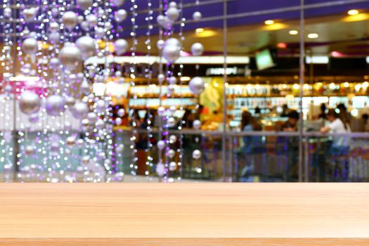 wood plank on bokeh purple lighting vivid colorful abstract background, empty wood table floors lighting decoration in shopping mall, wood table board empty front violet bokeh glitter interior light