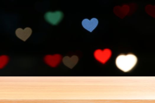 wood plank on lighting colorful heart shaped bokeh black background, empty wood table floors on heart shape bokeh night light multi color background, wood table board empty on bokeh heart shape light