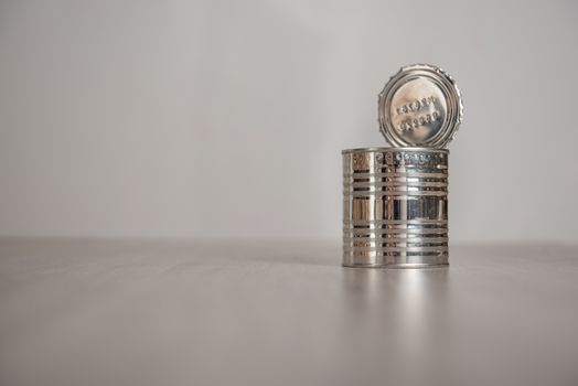 open tin can on a light background