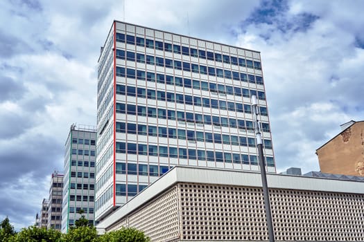 a series of modern high-rise buildings made of glass and aluminum in the center of Poznan