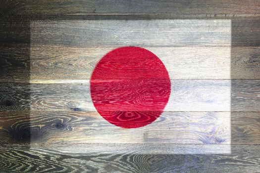 A Japan flag on rustic old wood surface background
