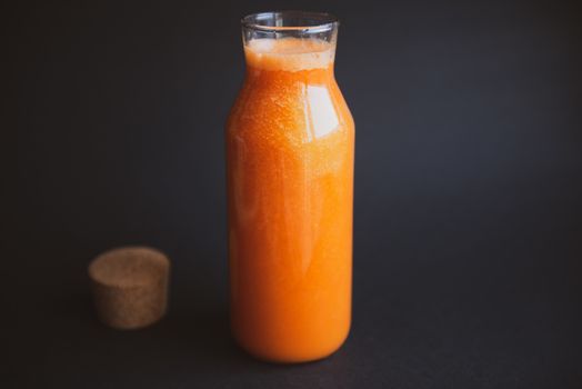 Healthy lifestyle. A close-up of a vegetarian fresh raw detox vegetable juice. Healthy Eating, Diet and Lifestyle Concept. The concept of beauty. Fresh juice in a retro glass jar on dark background with place for text