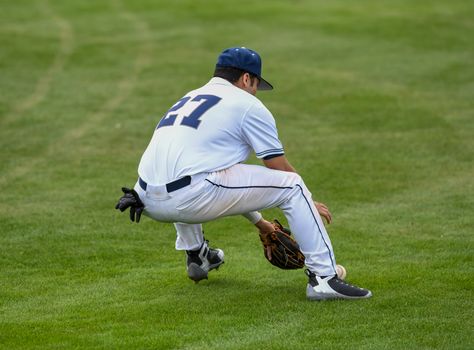 Action photo of high school baseball players making amazing plays during a baseball game