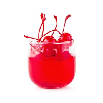Strawberry jelly in a glass topping with cherries isolated on white background.